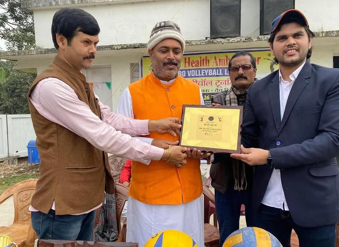 Dignitaries presenting an award at a group-sponsored volleyball event